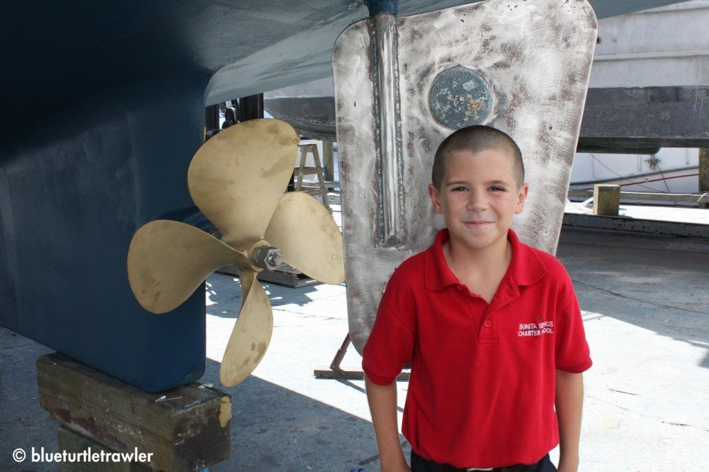 The boy (with fresh haircut) with the shiny prop and rudder