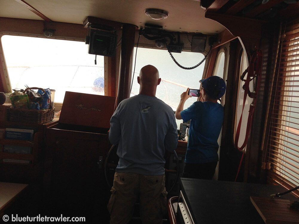 Captain Randy steering Blue Turtle through the storm